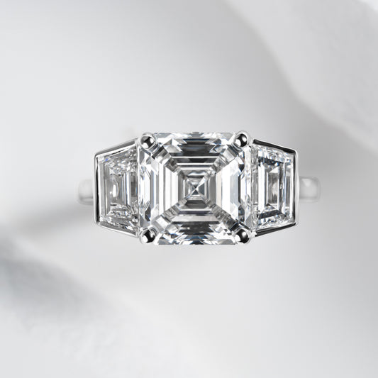 Asscher cut three stone ring 